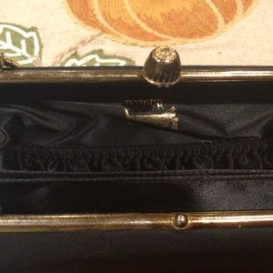 Black Ingber purse with gold chain handle.